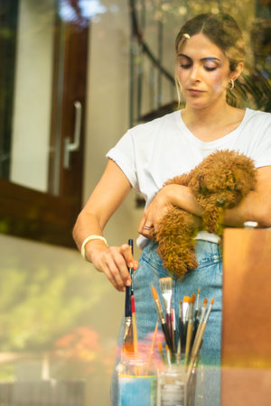 young blonde girl in Virtual class art in modern living roomの写真素材