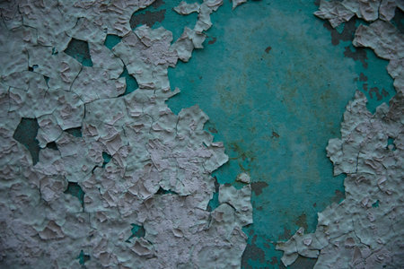 Grunge texture suitable for background or backdrop. Old wall with peeling paint giving a very...