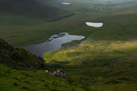 beautiful view of an Ireland landscape. Set of lakes with beautiful light and a ray of sunshine...
