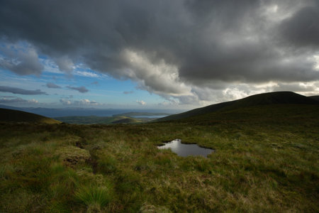 beautiful view of an Ireland landscape. Set of lakes with beautiful light and a ray of sunshine...