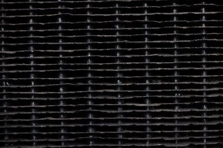 close up of a corrugated sheet of metal in black backgroundの写真素材