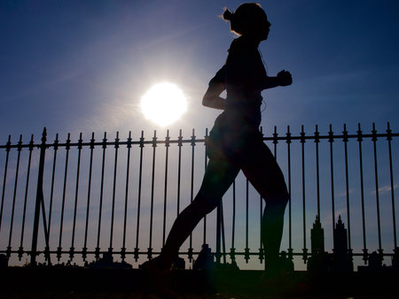 Woman running in park.のeditorial素材