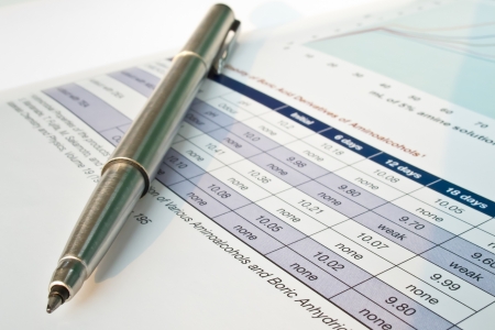 ballpoint pen and documents and data tableの写真素材