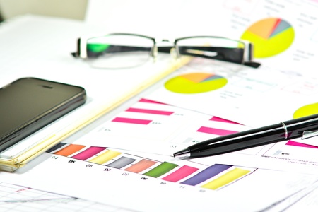 ballpoint pen and documents and graphの写真素材