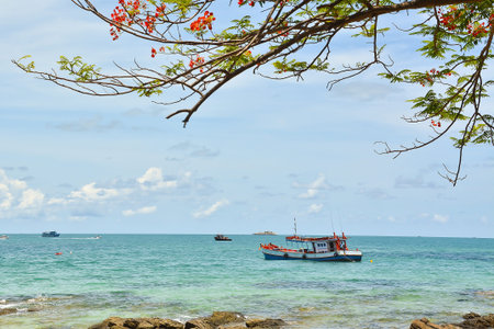 Fishing boat on the sea with blue skyの写真素材