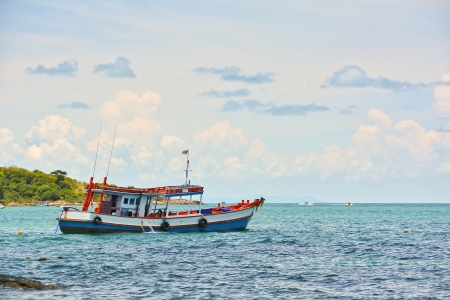 Fishing boat on the sea with blue skyの写真素材