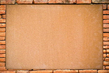 Blank board with brick frameの写真素材