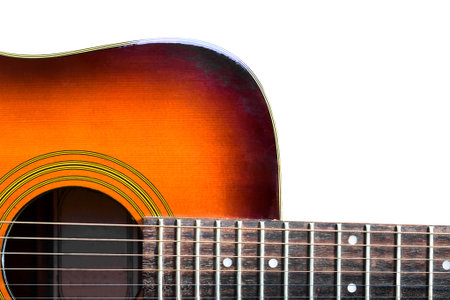 Steel string acoustic guitar isolated on whiteの写真素材