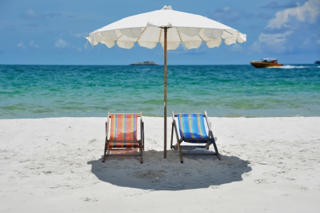 twin beach chair on the sea backgroundの写真素材