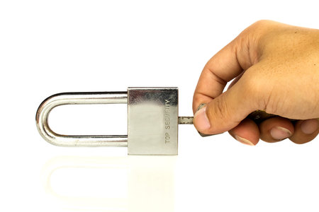 Master key with hand of someone on white background