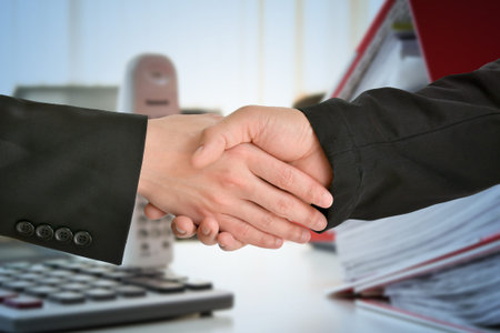  Business handshake closing a deal