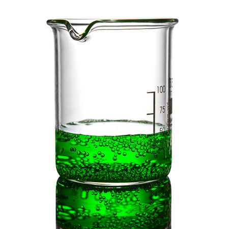 Beaker containing chemical liquid on white background
