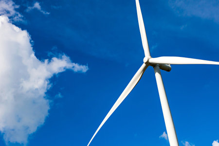 wind turbine with blue sky, renewable energy