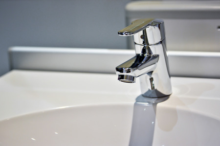 Modern faucet and wash basin in luxury bathroomの写真素材