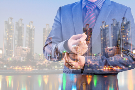 Business man in suit on blur city night backgroundの写真素材