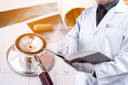 doctor with stethoscope on backgroundの写真素材