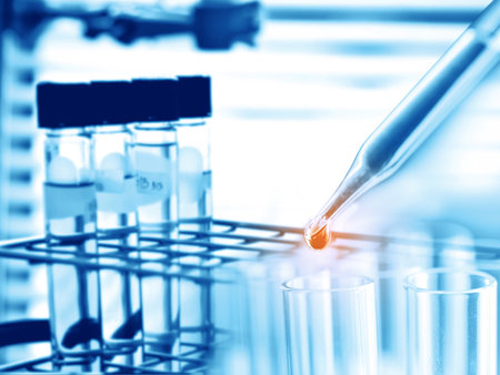 Dropping chemical liquid to test tubeの写真素材