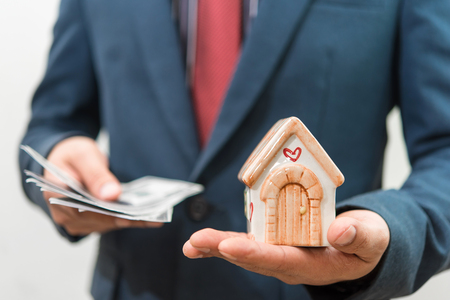 house model on hand of businessmanの写真素材