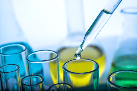 Dropping chemical liquid to test tubeの写真素材