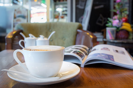 Cappuccino coffee on the table at cafeの写真素材