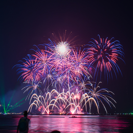 Beautiful firework display on celebration night, showing on the riverのeditorial素材