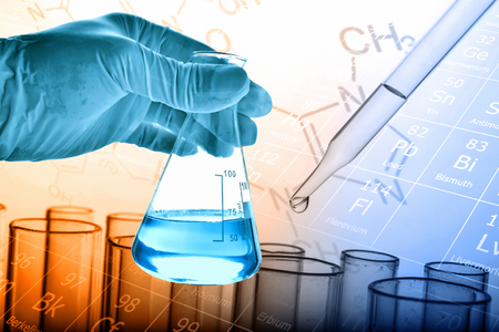 Flask in scientist hand with dropping liquid to test tube, Chemical, scientific research and development conceptの写真素材