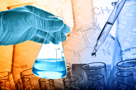 Flask in scientist hand with dropping liquid to test tube, Chemical, scientific research and development conceptの写真素材