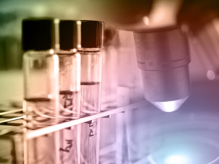 Microscope with lab glassware, laboratory research and development concept, lab analysis