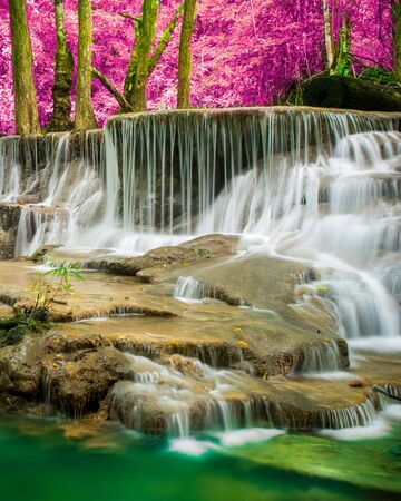 Amazing in nature, beautiful waterfall at colorful autumn forest in fall seasonの写真素材