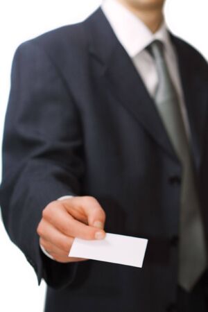 Young professional gives his business cardの写真素材