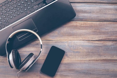 Flat lay photo of office desk with laptop, smartphone, copy space background. Music studio or recording studio. mockup.の写真素材