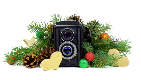 Retro camera and festive tinsel. Concept. Favorite hobbies. Job. Past. Technology in our lives....