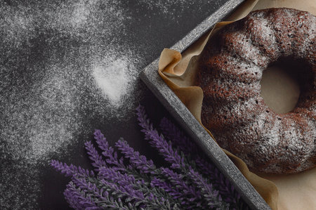 cake and flour on a dark background. Bakery shop bread, baked desserts, cakes and pastry cookies. Homemade food. Copy space. Top view and flat lay.の写真素材