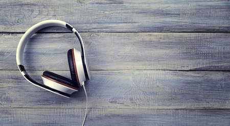 headphones on wooden background, top view, space for text. Relax with the music. Exercise, enjoyment, relaxationの写真素材