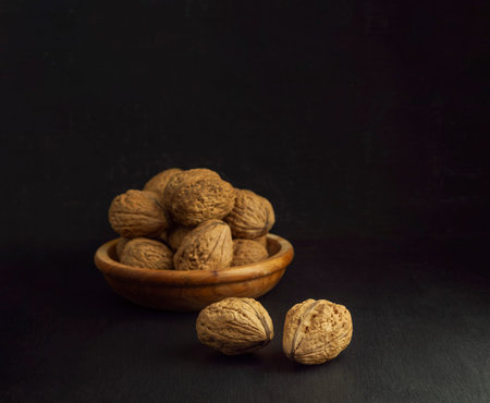 Inshell walnuts in a plate. Heart Nuts, Heart Health Products, Structured Walnuts. Healthy food...