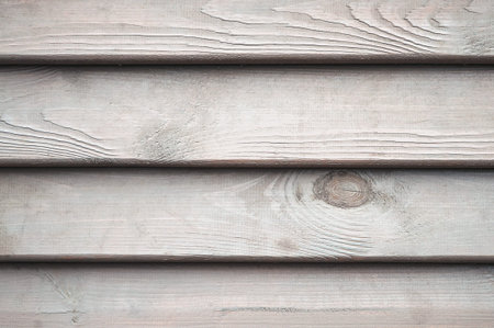 Wooden fence. Old wood surface. Wall of an old wooden building. rustic wood background. Old grunge...