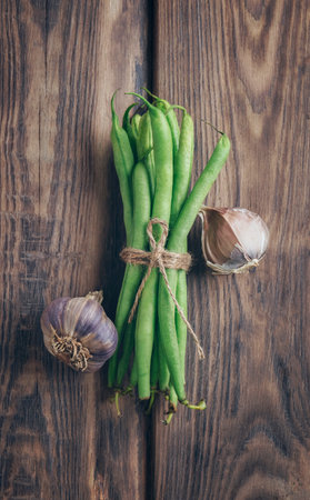 Green fresh asparagus beans close-up. Healthy food. Harvest from your own garden. Raw green bean pods. asparagus with spices. healthy food.Healthy breakfast delicious. Top view flat lay. Copy space.の写真素材
