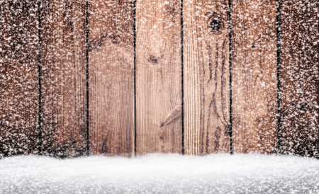 Winter background - dark wooden rustic background covered with snow. Abstract Snowy Christmas Background. Christmas winter background made of snowflakes and snow with empty copy space for your textの写真素材