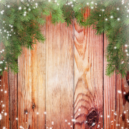 Colorful Christmas background. Spruce branches and snow. Card. Greeting. Winter. Old Wooden background.の写真素材