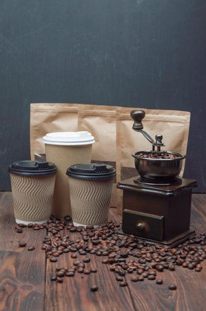 Coffee beans, mill, ground coffee on wooden table. Copyspace. Coffee lover conceptの写真素材