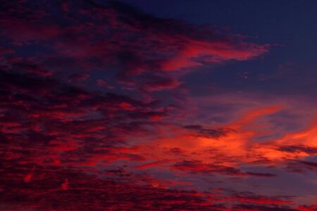 Sunset / sunrise with clouds, light rays and other atmospheric effectの写真素材