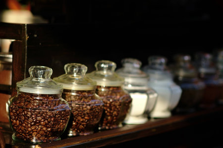 Coffee beans in glass jarsの写真素材
