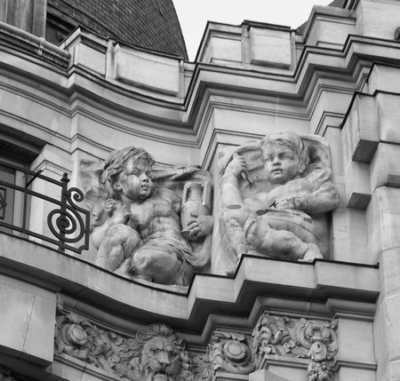 stone cherubs on a buildingの写真素材