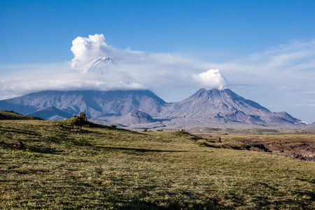 Volcanoes Klyuchevskaya Sopka, Kamen and Nameless during the eruption, Kamchatka