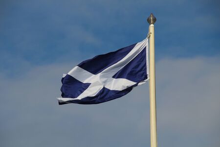 In the wind waving flag of Scotlandの写真素材