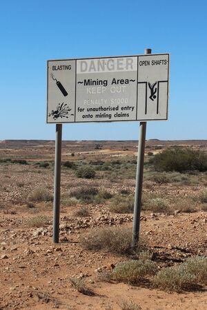 Warning sign at Coober Pedy in South Australiaの写真素材