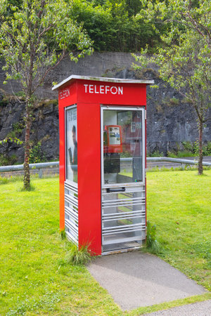 Norway, Vestland, Norheimsund - July 15, 2023: Norwegian telephone boothのeditorial素材