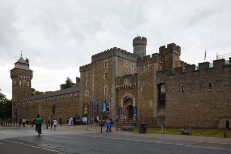 Wales, Cardiff - June 30, 2024: Cardiff Castle at the transition from Castle Street to Duke Street.のeditorial素材