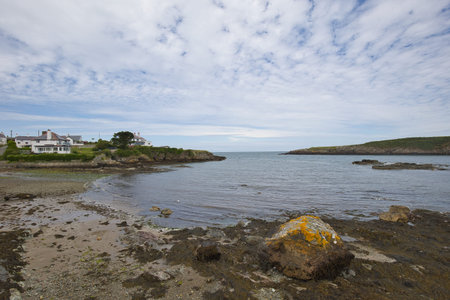 Cemaes Bay on Little Beach in the village of Cemaes in Wales.
