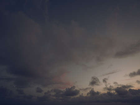 Panorama evening sky with blue, white and orange cloudsの写真素材